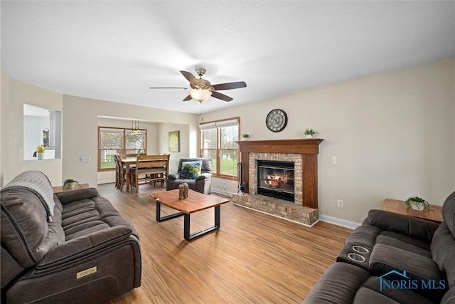 1528 Indian Creek Dr, Perrysburg, OH 43551 - living area featuring ceiling fan, wood finished floors, and a brick fireplace