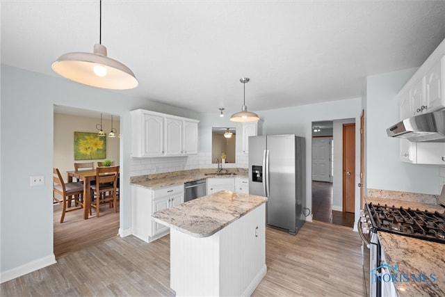 1528 Indian Creek Dr, Perrysburg, OH 43551 - kitchen featuring stainless steel appliances, under cabinet range hood, light wood finished floors, and white cabinets