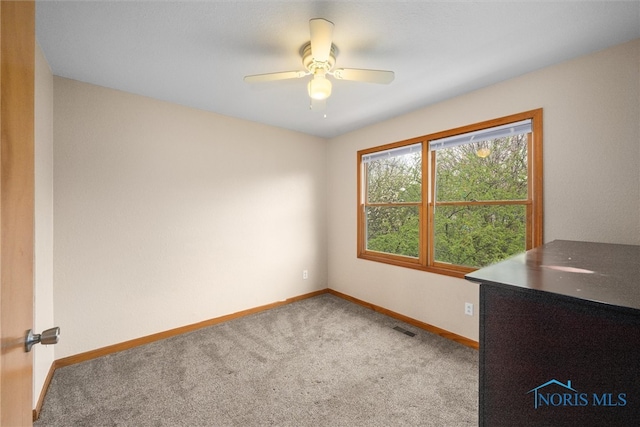 1528 Indian Creek Dr, Perrysburg, OH 43551 - carpeted spare room featuring baseboards and a ceiling fan