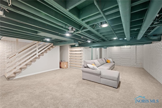 1528 Indian Creek Dr, Perrysburg, OH 43551 - finished below grade area featuring brick wall, stairway, and carpet flooring
