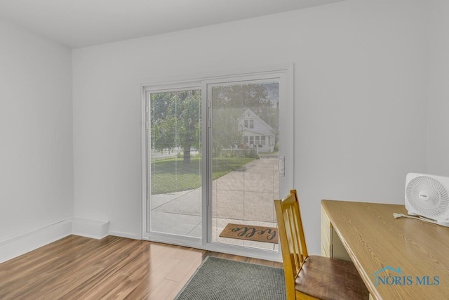 3133 126th St, Toledo, OH 43611 - doorway to outside with wood finished floors and baseboards