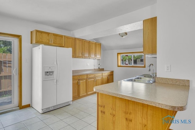 3133 126th St, Toledo, OH 43611 - kitchen with white refrigerator with ice dispenser, healthy amount of natural light, light countertops, and brown cabinets