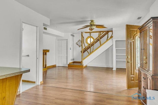 3133 126th St, Toledo, OH 43611 - foyer entrance featuring stairway, light wood finished floors, and a ceiling fan