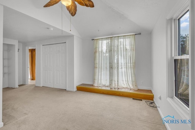 3133 126th St, Toledo, OH 43611 - unfurnished bedroom featuring vaulted ceiling, carpet, and a ceiling fan