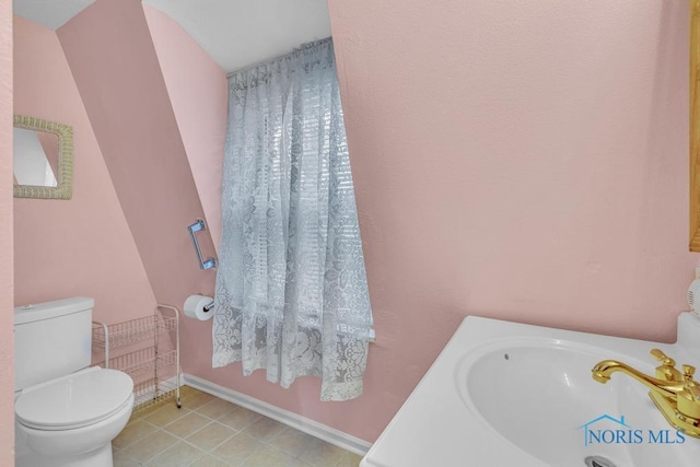 3133 126th St, Toledo, OH 43611 - bathroom with toilet and baseboards