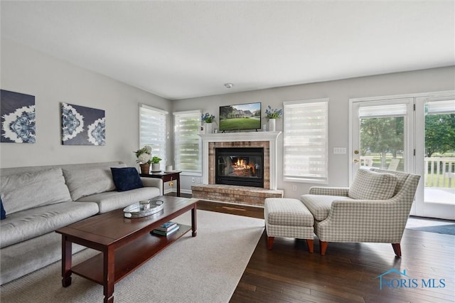 7713 Rome Ct, Holland, OH 43528 - living room with a brick fireplace and wood-type flooring