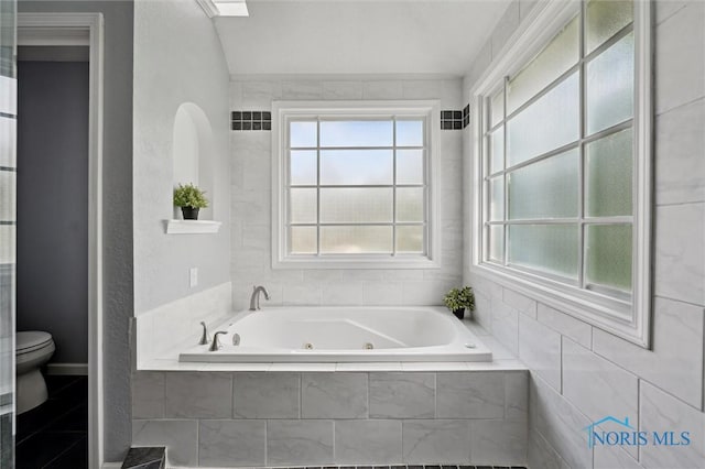 7713 Rome Ct, Holland, OH 43528 - full bath featuring toilet and a tub with jets