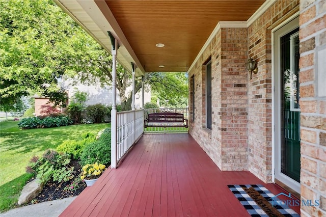 7713 Rome Ct, Holland, OH 43528 - wooden porch featuring a yard