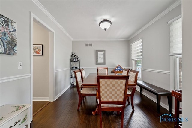 7713 Rome Ct, Holland, OH 43528 - dining space featuring dark wood-style flooring and crown molding