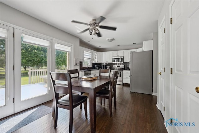 7713 Rome Ct, Holland, OH 43528 - dining room featuring dark wood finished floors and a ceiling fan