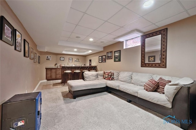 7713 Rome Ct, Holland, OH 43528 - carpeted living room featuring bar area, a paneled ceiling, and recessed lighting