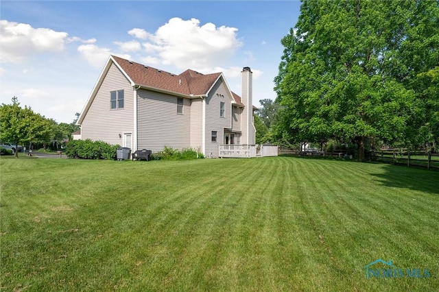 7713 Rome Ct, Holland, OH 43528 - rear view of property featuring a chimney