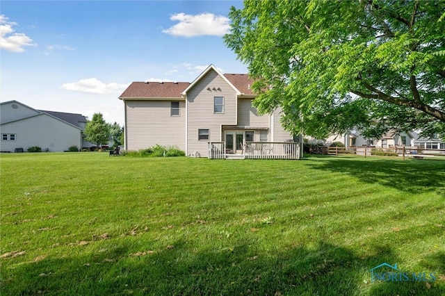 7713 Rome Ct, Holland, OH 43528 - back of property with a lawn, french doors, and a wooden deck