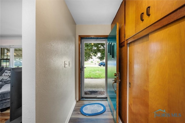 3171 Astor Ave, Toledo, OH 43614 - doorway to outside featuring wood finished floors and a textured wall