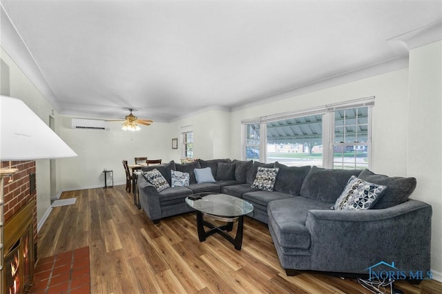3171 Astor Ave, Toledo, OH 43614 - living room with wood finished floors, ceiling fan, and a wall mounted AC