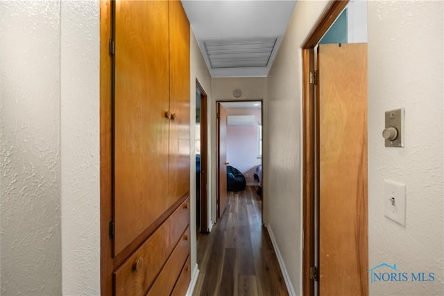 3171 Astor Ave, Toledo, OH 43614 - hall featuring dark wood-style floors, a wall mounted air conditioner, and a textured wall