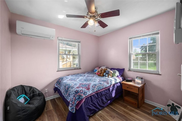 3171 Astor Ave, Toledo, OH 43614 - bedroom with a wall mounted air conditioner, wood finished floors, and ceiling fan