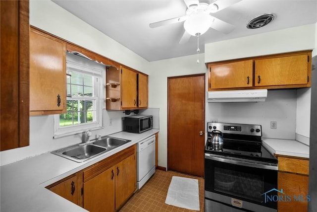 3171 Astor Ave, Toledo, OH 43614 - kitchen with stainless steel electric range oven, extractor fan, white dishwasher, black microwave, and light countertops