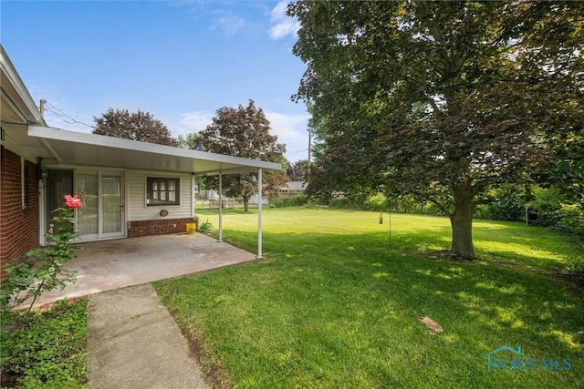 3171 Astor Ave, Toledo, OH 43614 - view of green lawn with a patio area