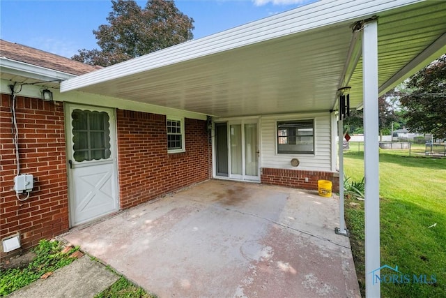 3171 Astor Ave, Toledo, OH 43614 - view of patio / terrace featuring a carport and concrete driveway