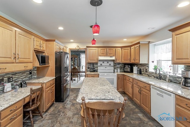 7325 Winsford Ln, Sylvania, OH 43560 - kitchen featuring stainless steel appliances, under cabinet range hood, stone finish flooring, tasteful backsplash, and recessed lighting