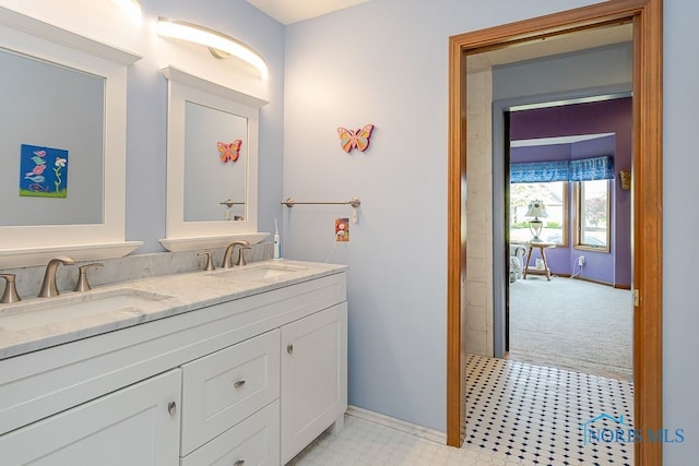 7325 Winsford Ln, Sylvania, OH 43560 - full bath with double vanity and baseboards