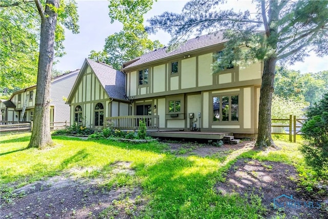 2325 Saint Roberts Ln, Toledo, OH 43617 - back of property with stucco siding, a wooden deck, and roof with shingles