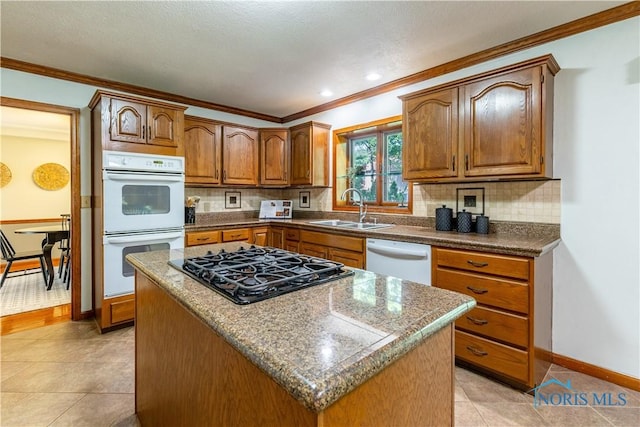 2325 Saint Roberts Ln, Toledo, OH 43617 - kitchen featuring white appliances, crown molding, tasteful backsplash, brown cabinets, and light tile patterned floors