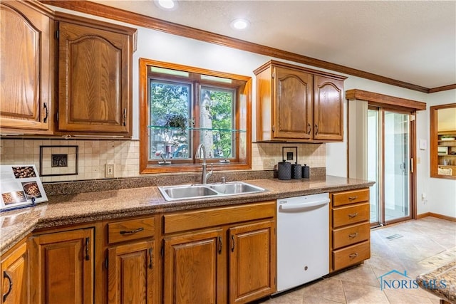 2325 Saint Roberts Ln, Toledo, OH 43617 - kitchen featuring white dishwasher, brown cabinetry, and ornamental molding