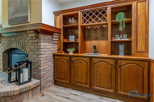 2325 Saint Roberts Ln, Toledo, OH 43617 - bar with a sink and light wood-type flooring