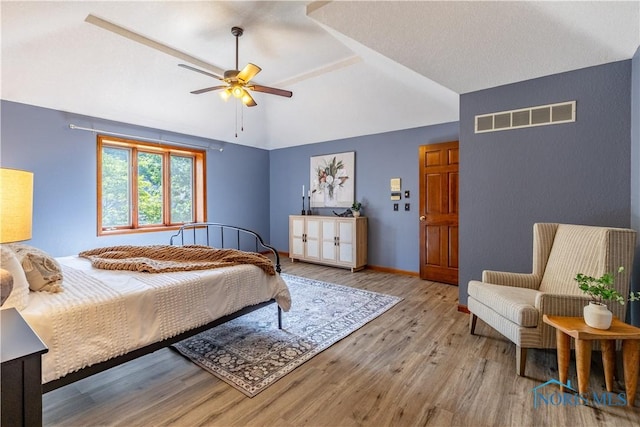 2325 Saint Roberts Ln, Toledo, OH 43617 - bedroom with wood finished floors, vaulted ceiling, and a ceiling fan