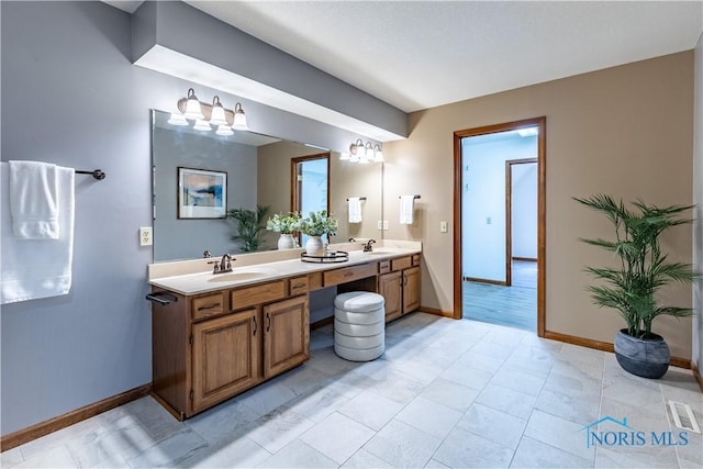 2325 Saint Roberts Ln, Toledo, OH 43617 - full bathroom with double vanity and a chandelier