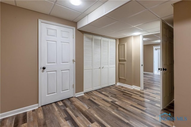 2325 Saint Roberts Ln, Toledo, OH 43617 - unfurnished bedroom featuring a drop ceiling, wood finished floors, and a closet