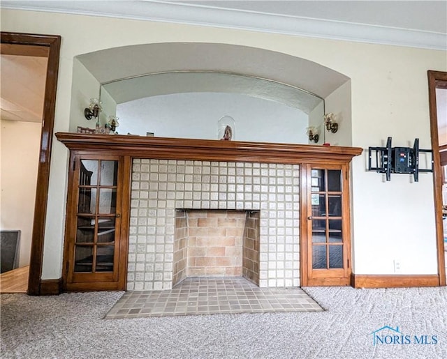120 Elm St, Fostoria, OH 44830 - detailed view of carpet flooring, ornamental molding, and a tiled fireplace