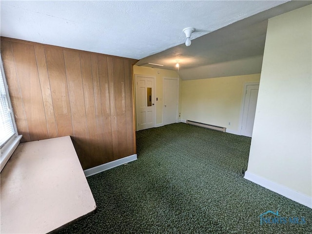 120 Elm St, Fostoria, OH 44830 - carpeted empty room featuring baseboard heating, wood walls, and electric panel