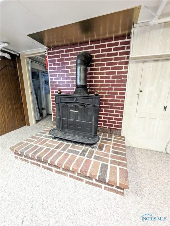120 Elm St, Fostoria, OH 44830 - detailed view of a wood stove and carpet floors