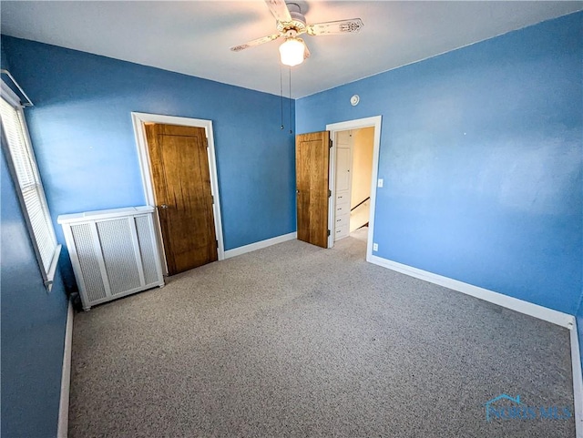 120 Elm St, Fostoria, OH 44830 - unfurnished bedroom with radiator, carpet, and ceiling fan