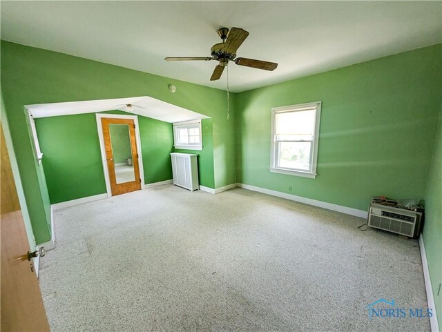120 Elm St, Fostoria, OH 44830 - unfurnished bedroom with carpet floors, ceiling fan, and radiator heating unit