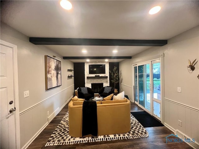 3822 Sylvan Wood Dr, Sylvania, OH 43560 - living area with a fireplace, dark wood-style floors, beamed ceiling, recessed lighting, and a wainscoted wall