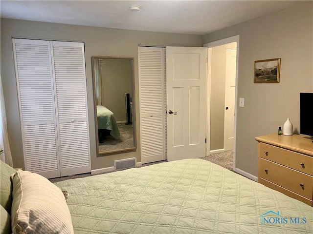 3822 Sylvan Wood Dr, Sylvania, OH 43560 - carpeted bedroom with multiple closets and baseboards
