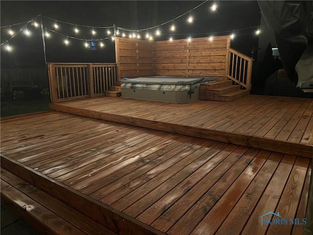 3822 Sylvan Wood Dr, Sylvania, OH 43560 - deck at night featuring a covered hot tub