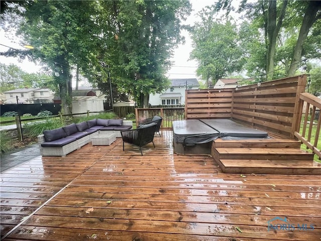 3822 Sylvan Wood Dr, Sylvania, OH 43560 - deck featuring a covered hot tub, a storage unit, and outdoor lounge area