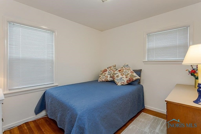 921 7th St, Maumee, OH 43537 - bedroom with wood finished floors and baseboards