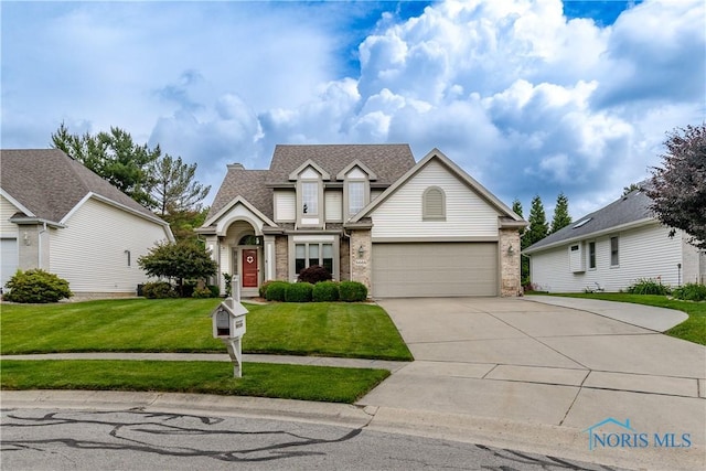 6666 Brick Yard Ct, Maumee, OH 43537 - traditional-style house with driveway, a front lawn, a garage, and a shingled roof