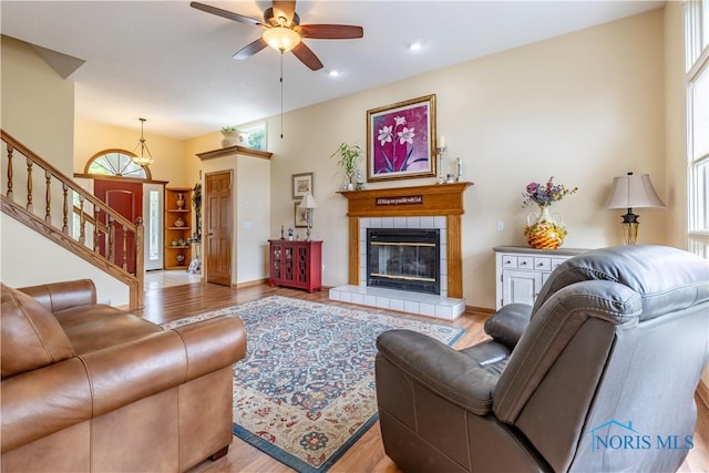 6666 Brick Yard Ct, Maumee, OH 43537 - living area with light wood-style floors, a fireplace, ceiling fan, stairs, and recessed lighting