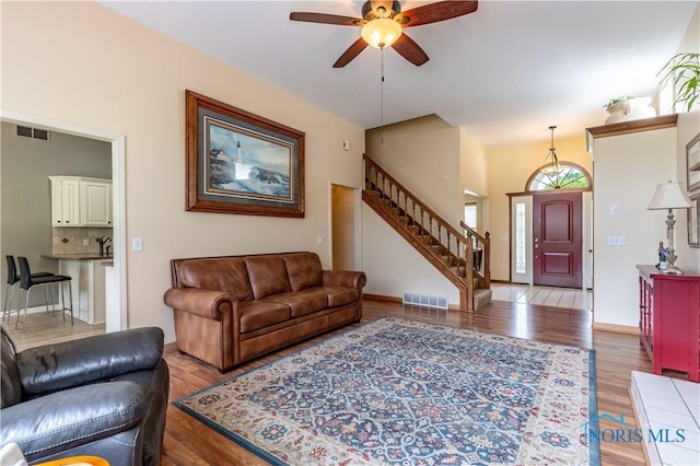 6666 Brick Yard Ct, Maumee, OH 43537 - living area with a ceiling fan, stairs, and wood finished floors