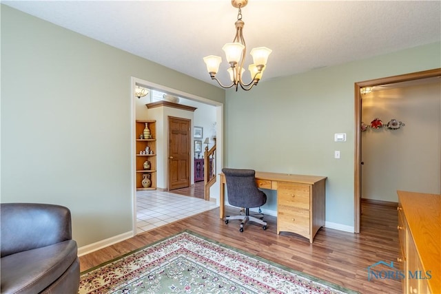 6666 Brick Yard Ct, Maumee, OH 43537 - office featuring a chandelier and wood finished floors