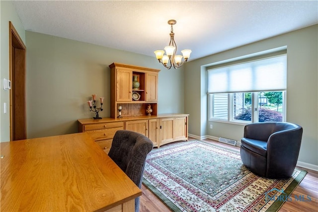 6666 Brick Yard Ct, Maumee, OH 43537 - office featuring a chandelier and wood finished floors