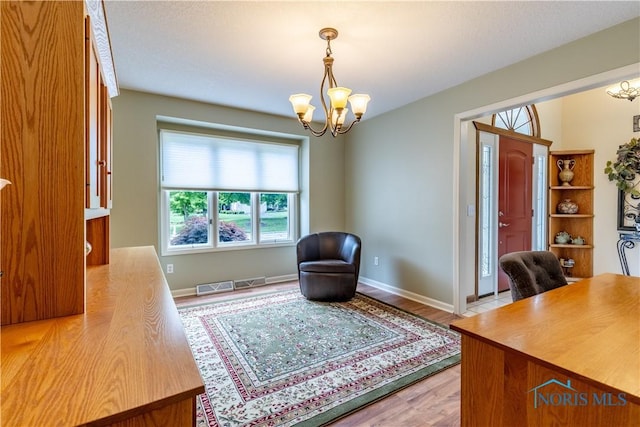 6666 Brick Yard Ct, Maumee, OH 43537 - office area with a chandelier and light wood-type flooring
