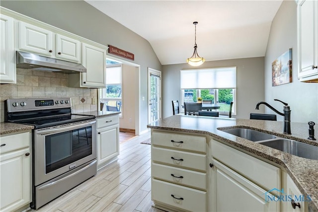6666 Brick Yard Ct, Maumee, OH 43537 - kitchen featuring stainless steel electric range, under cabinet range hood, backsplash, white cabinetry, and lofted ceiling